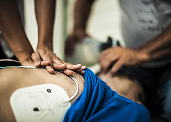 A man being given CPR