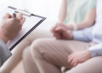 A doctor recording patient information