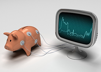 a piggy bank hooked up to an ECG