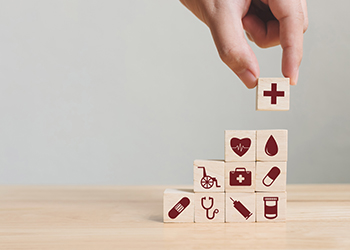 building blocks with health icons