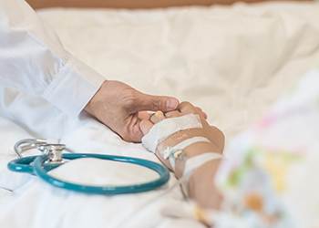 child in hospital bed