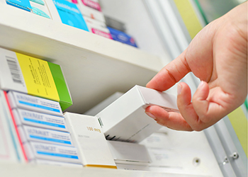 A pharmacy shelf full of medications