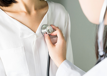 A woman having her heart rate measured