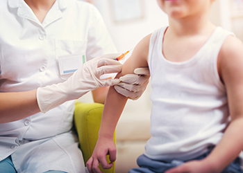 A little boy gets a vaccination
