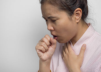 A woman coughing