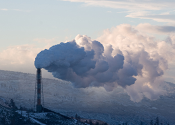 An industrial chimney belching out smoke