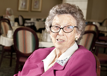 A senior lady in a dining room