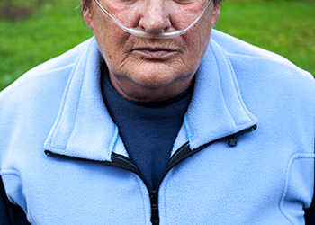 A man breathing via an oxygen tank