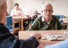 Older adults gather for recreational activities in a day centre