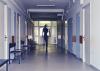 A person walking out of a hospital