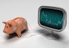 A piggy bank hooked up to an ECG