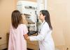 A woman having a breast screening exam