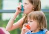 Two children with inhalers