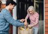 A boy bringing groceries an older lady at home