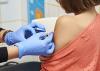 A young girl getting a vaccination