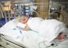 A premature baby in a NICU incubator